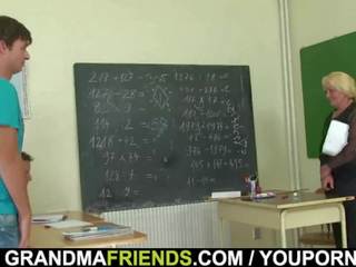Very old teacher is pounded by two fellows